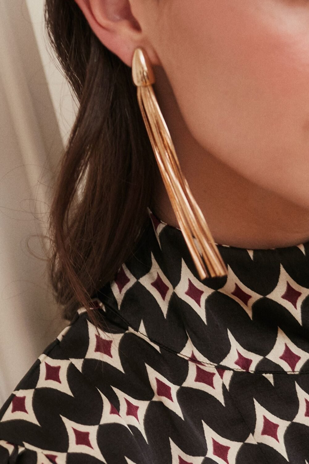 Pendientes largos dorados flecos