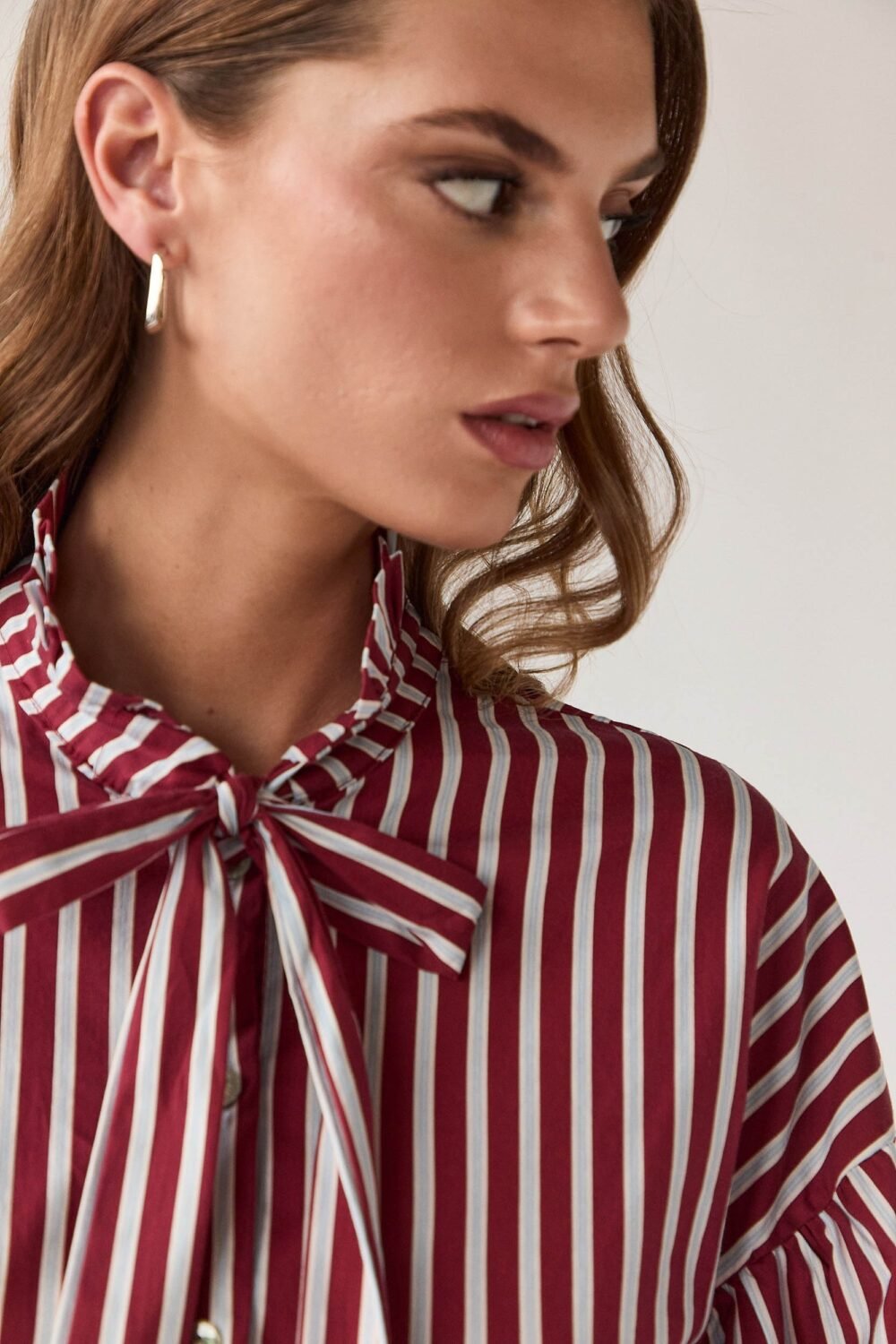Blusa lazo rayas manga abullonada vino